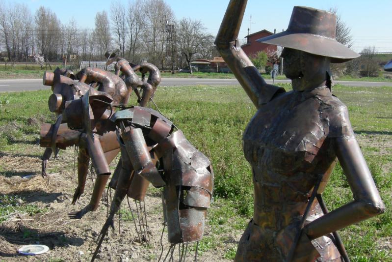 Copper sculpture of rice-workers